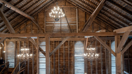 Interior of a Fancy Barn With Chandeliers and Windows