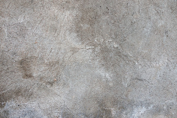 Dark plaster wall with dirty cracked scratched background. Old retro vintage brickwall with peel grey stucco texture