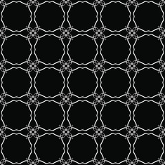 Naklejka premium Seamless oriental pattern with Arabic ornaments. White lines on a black background.