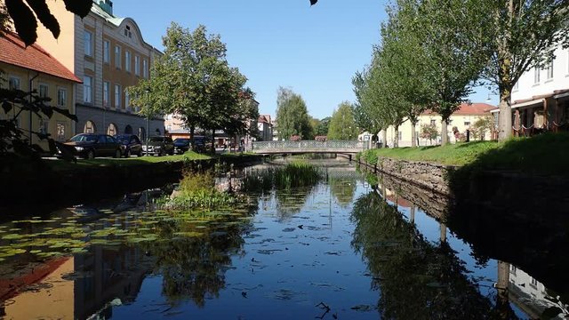 Establishing shot of the bridge over lillan connecting lilla torget and stora torget in alingsas sweden