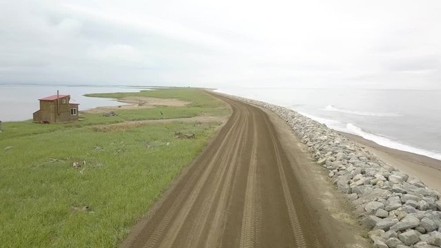 Aerial view of native fish camps and wooden cabins along the Bering Sea. Nome - Council Highway
, Alaska.
