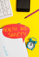 Text sign showing Health And Safety question. Business photo showcasing regulations and procedures intended to prevent accident Empty red bubble paper on the table with pc keyboard