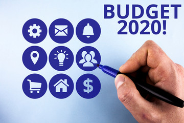 Conceptual hand writing showing Budget 2020. Concept meaning estimate of income and expenditure for next or current year Male designing layout presentation concept for business promotion