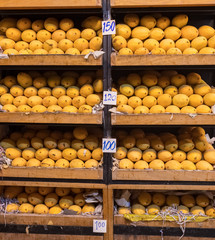 Pile of fresh yellow ripped Thai mango names Mamuang Kaew displayed on fruits stall shop