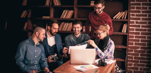 team of copywriters discussing a new advertising project