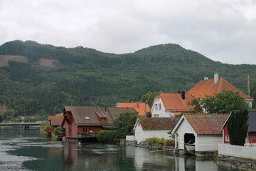 Fototapeta na wymiar Houses in Hellesylt, Norway at the head of Storfjorden