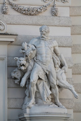 Fototapeta na wymiar Statue of Hercules and Cerberus at the Hofburg Imperial Palace in Vienna, Austria