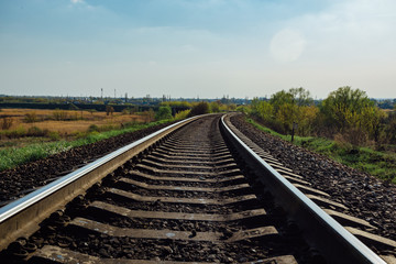 Fototapeta premium Empty railway track in sunny summer day