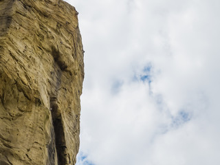 Fototapeta na wymiar Cliff with iron mounts for rock climbers training