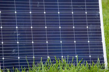 large solar panel stands on the grass