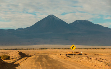 Sand Road at Atacama Desert with Volcano on the Background