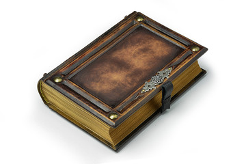 Aged brown leather book with the frame, metal pins in the corners and door handle decoration