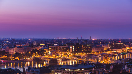 Fototapeta na wymiar Panoramic cityscape of Chain Bridge on the Danube river. Colorful sunrise in Budapest, Hungary