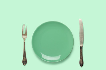 A plate and a silverware on a table