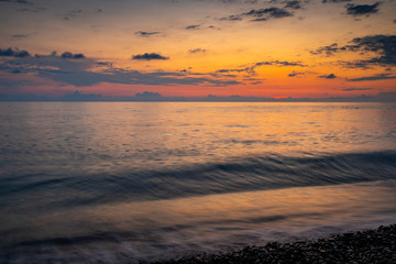 Sea waves of Black sea on Kvariati beach in Georgia. Beautiful sunset. Travel.
