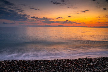Sea waves of Black sea on Kvariati beach in Georgia. Beautiful sunset. Travel.