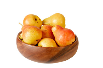 Pear in wooden bowl on white. Organic pear fruits isolated on white background.