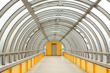 Pedestrian bridge across the road in the form of an arch