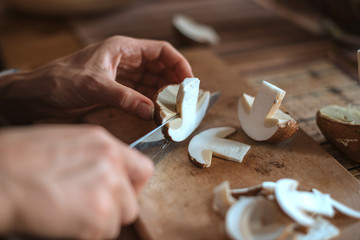 Slicing white mushroom. Preparation for drying