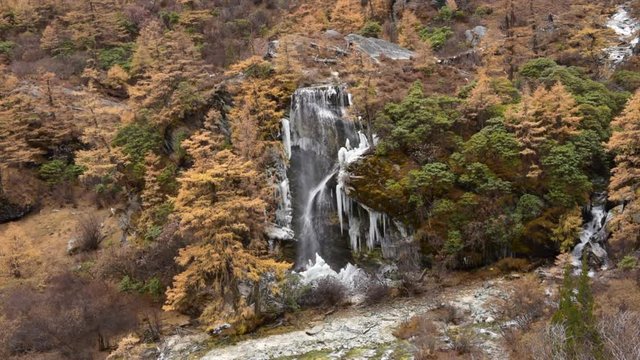 Ice waterfall in Yading nature reserve in autumn, China 