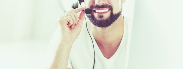 Businessman in the office on the phone with headset, Skype