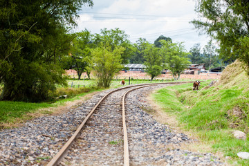 Fototapeta na wymiar View of the railroad tracks in rural area of the Department of Boyaca in Colombia
