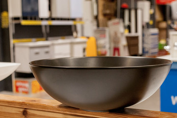 Picture of ceramic wash basin with chrome tap in bathroom fitment store