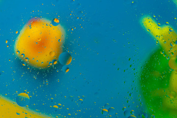 Micro molecular abstract pattern of colored oil bubbles on water. 