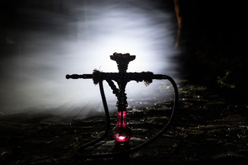 Hookah hot coals on shisha bowl with black background. Stylish oriental shisha. Shisha Concept