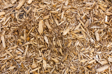 brown texture of pieces of wood sawdust thyrs bark chips closeup