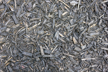 gray texture of pieces of wood sawdust thyrs bark chips closeup