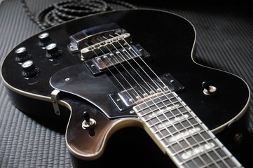 Obraz na płótnie Canvas Black electric guitar