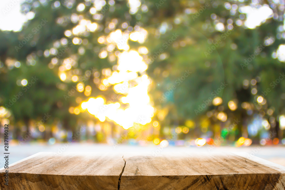 Wall mural empty wooden on blurred nature backdrop. wood table top. can used for display or montage your produc