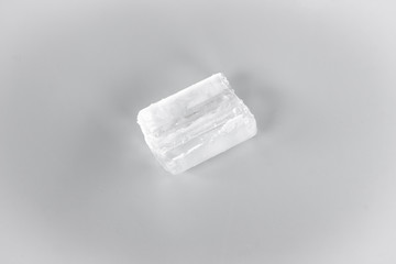 white ice on gray background. frozen water 