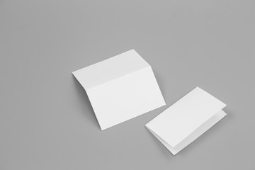 Blank portrait mock-up paper. brochure magazine isolated on gray, changeable background / white paper isolated on gray