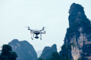 Fototapeta na wymiar Flying drone taking photo outdoor
