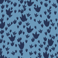 Vector blue dinosaur footprints repeat pattern. Perfect for textile, giftwrap and wallpaper. © Jamie Soon