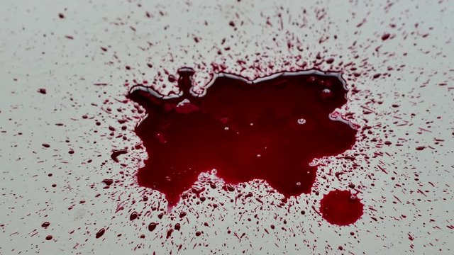 Top view red blood splash dropping on old gypsum plates.