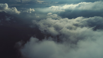 Obraz premium aerial fly above clouds with blue sky in backgroubnd on beautiful sunny day