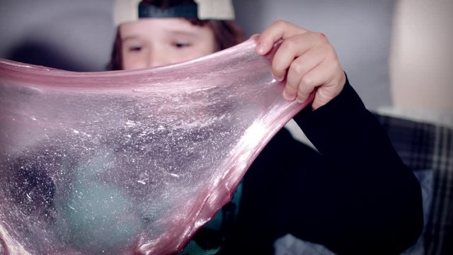 4k Dolly Shot of Child Playing with DIY Slime Toy