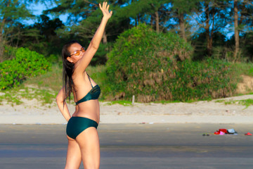 Woman and bikini beautiful with sunshine on beach