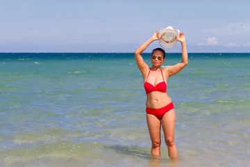 Fototapeta na wymiar Woman body beautiful with red bikini on beach