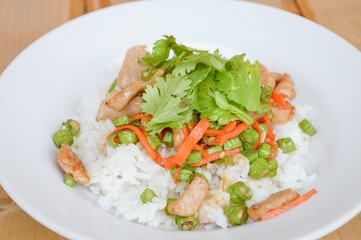 pork and vegetable fried on hot rice - Thailand healthy food