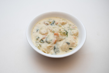 Traditional Italian chicken gnocchi soup in a bowl