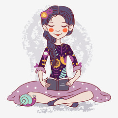 Cute girl reads a book