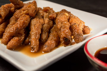 Chinese Cooked Chicken feed or Braised chicken on white plate