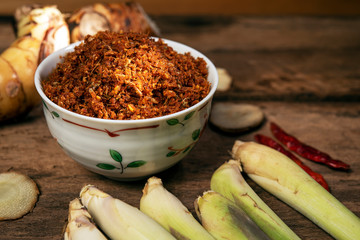 Galangal chili paste or Nam Prik Kha North Local thai food on old wood background drak style