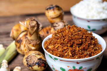 Galangal chili paste or Nam Prik Kha North Local thai food on old wood background drak style