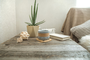 Home interior with decorative items on a wooden table.