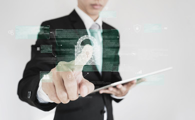 Businessman pressing on digital lock icon on screen. Business data security system technology